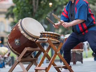 Man Playing Drums of Japanese Musical Tradition during a Public Outdoor Event