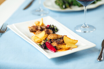 Closeup on grilled chicken with potatoes