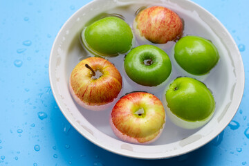 Washing fresh apples in the water