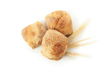 Buns and wheat ears isolated on white background