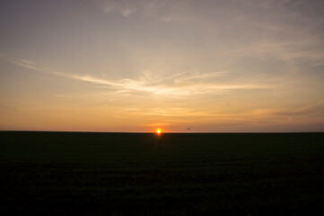 Sunset over a field in autumn