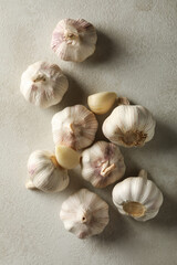 Raw garlic on light background, top view