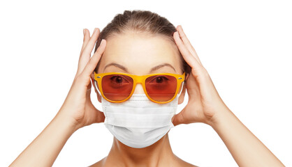 pandemic, health and people concept - portrait of surprised teenage girl in sunglasses wearing face protective medical mask for protection from virus disease