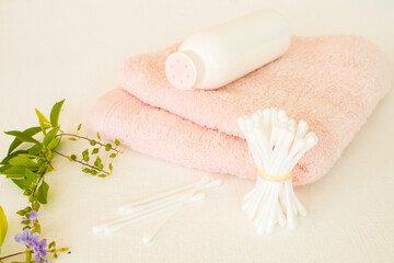 cotton buds ,powder and terry cloth health care of lifestyle woman arrangement flat lay style on background wooden white
