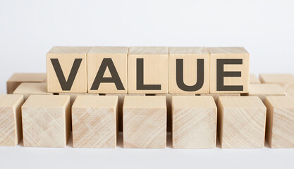 VALUE word from wooden blocks on the desk, search engine optimization concept
