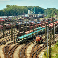 marshalling yard with tracks, switches, freight trains and the signal box, Germany