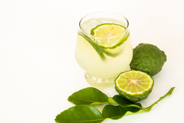 herbal healthy drinks iced kaffir lime cocktail water with bergamot slice local flora of asia arrangement flat lay style on background white