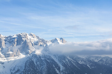 View of the snow-capped mountain peaks against the sky. Concept background, landscape.