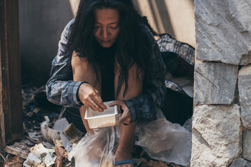 poor people,homeless or beggar begging for help sitting at dirty slum.concept for poverty...