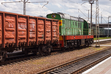 Lutsk, Ukraine, July 22, 2020: A locomotive with freight cars at the railway station