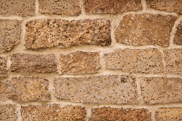 Part of a stone brick light antique wall.