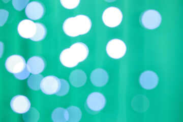 Blurred Christmas lights on color background