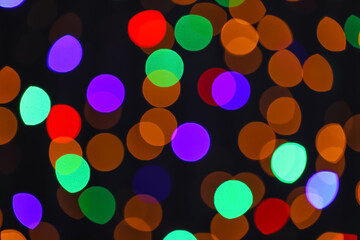 Blurred Christmas lights on dark background