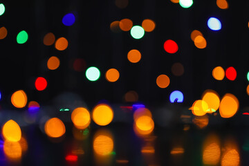 Obraz premium Blurred Christmas lights on dark background