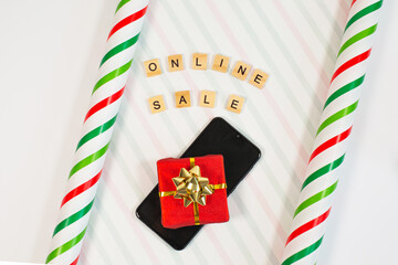 Fototapeta premium Online shopping concept with wrapping paper, gift, phone