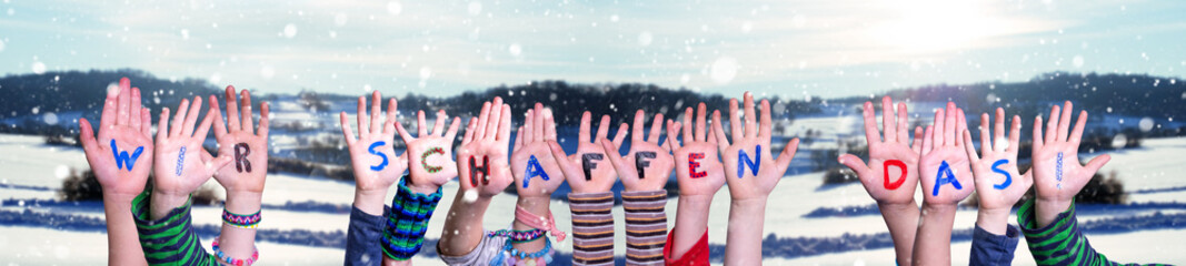 Children Hands Building Colorful German Word Wir Schaffen Das Means We Can Do It. Snowy Winter Background With Snowflakes