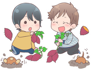 芋掘りをする子供