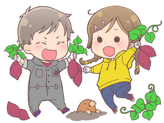 芋掘りをする子供