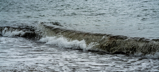 Waves coming ashore on the Baltic coast at high tide.