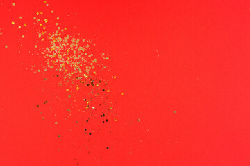 Christmas Gold glitter on red background. Holiday abstract