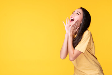 Young woman covers her mouth surprised excited while looking at product on sale promotion or empty...