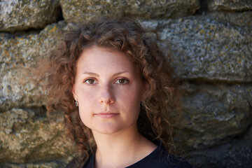 Portrait of a pretty woman with curly hair.