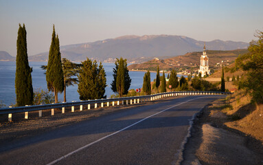 Fototapeta premium Dawn on the coast of Crimea. Lighthouse Church of St. Nicholas the Wonderworker