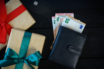 Christmas online shopping top view with money and wallet, gift box