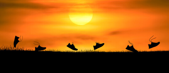 Concept design for Trail running : Silluette running Shoe runnong along the track at the sunset time.