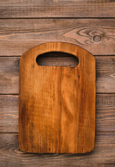 Wooden cutting board, handmade wood cutting board on wooden craft table.