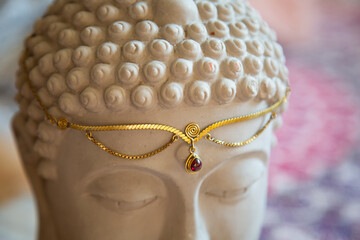 Brass tiara with gemstone on Buddha statue head