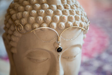 Brass tiara with gemstone on Buddha statue head