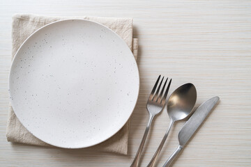 empty plate or dish with knife, fork and spoon - obrazy, fototapety, plakaty