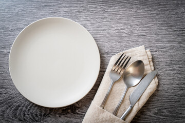 empty plate or dish with knife, fork and spoon