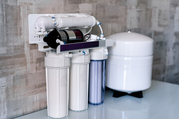 Household filtration system. Water treatment concept. Use of water filters at home. Special technic...