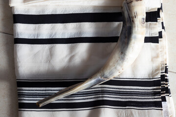 A shofar placed on a tallit, before the Tishrei holidays