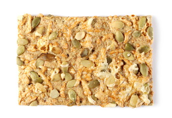 Crispbread with Gouda cheese and pumpkin seeds isolated on white background, top view