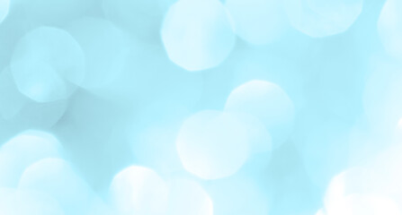 Bokeh light on blue background, sky with circle glitter light blue. Snow abstract soft glowing with vivid bright light and bokeh blur effect. 