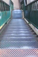 Obraz premium Old steel stairs of overpass on background , high walkway down