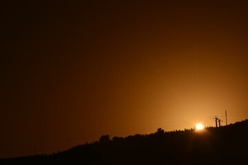 Sunset behind the mountain, monochromatic