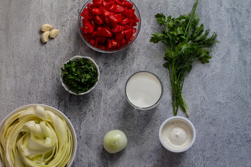zucchini pasta prepared raw ingredients cream cheese garlic and herbs