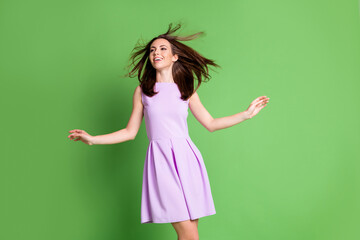 Photo of nice pretty adorable lady model look empty space hands airy light fly wind blowing hair volume shampoo conditioner effect wear purple dress isolated pastel green color background