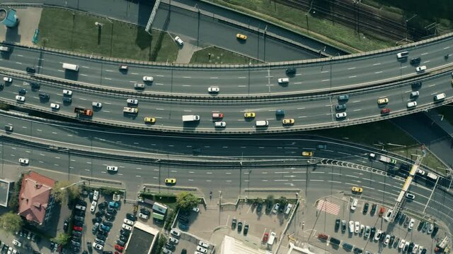 Aerial overhead shot of slow road traffic on a highway curve
