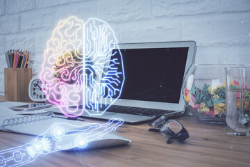 Double exposure of work space with computer and human brain drawing hologram. Brainstorm concept.