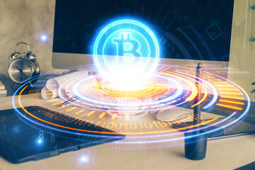 Double exposure of blockchain theme hologram and table with computer background. Concept of bitcoin crypto currency.