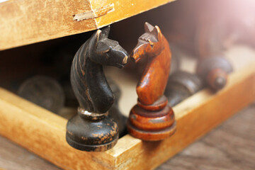 Two chess knights, a retro wooden game © sabdiz