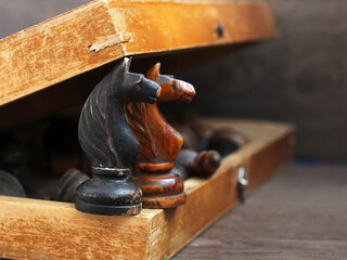 Two chess knights, a retro wooden game © sabdiz