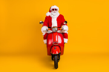 Portrait of his he nice funny fat confident Santa St Nicholas driving motor bike traveling way road...