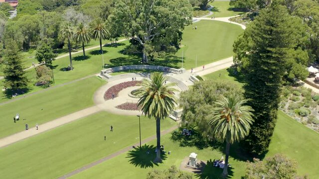 drone perth australia going around park where the war monumen is in a sunny day