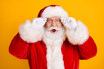 Portrait astonished santa claus impressed x-mas fairy tradition christmas discount touch white gloves specs wear style stylish trendy red costume cap isolated bright shine color background